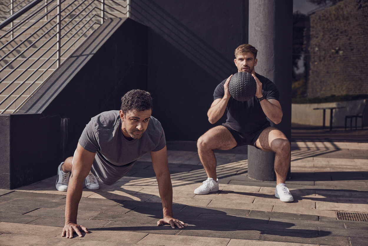 Two Planet Fitness Members training outdoor gym